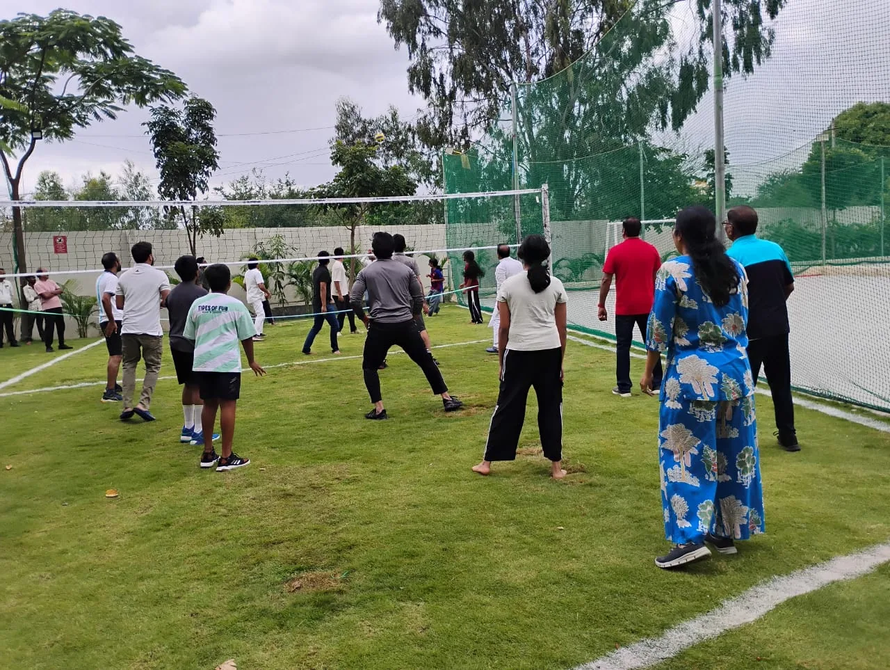 Residents playing together on the newly opened volleyball court