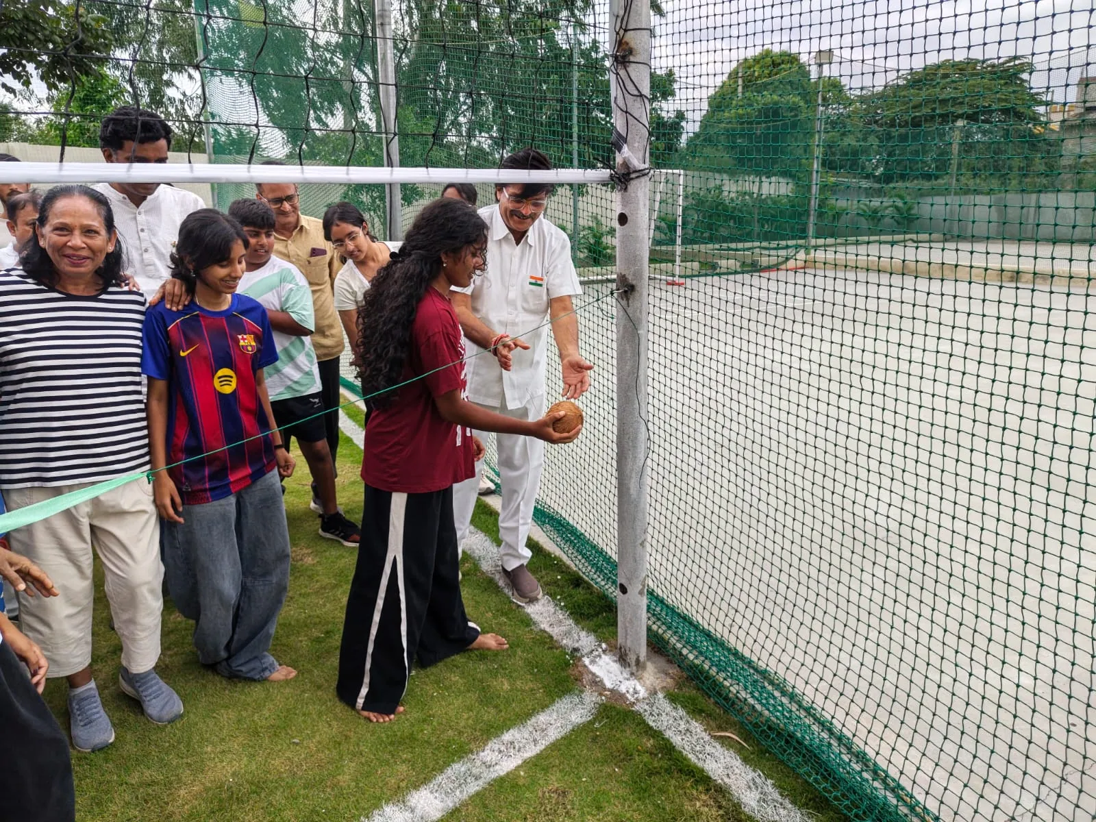 A young resident taking part in the volleyball court inauguration